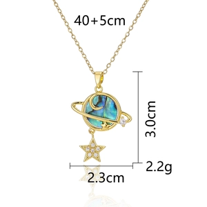Detail view of shell planet pendant with white star zircon and size specifications