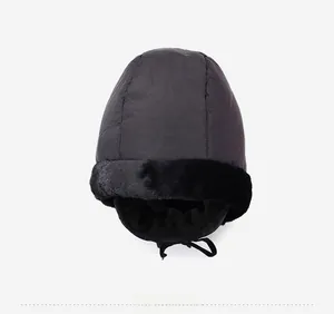 Top view of a black windproof winter trapper hat with warm fleece lining and neck warmer