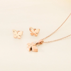 Rose gold jewelry set with crystal butterfly pendant necklace and matching stud earrings