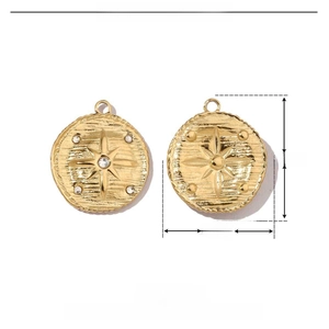Polished starburst charm in gold stainless steel with rhinestones and 21mm size detail