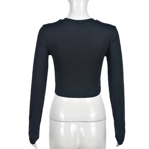 Rear view detail of black slim-fit cropped long-sleeve top with elegant neckline