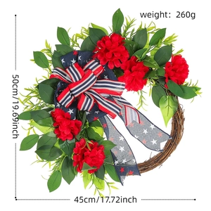 Patriotic wreath with red flowers and US flag ribbons, dimensions 50cm by 45cm