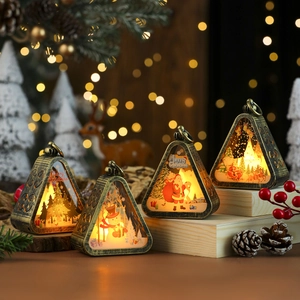 Detail of vintage bronze Christmas lanterns with LED lights and festive character prints