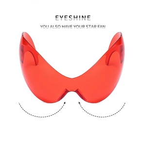 Front view of Y2K tech-style red oversized wraparound sunglasses with EYESHINE branding