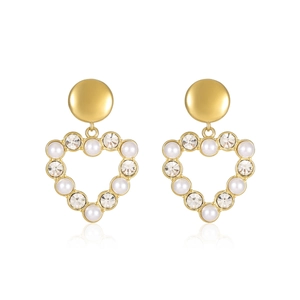 Golden heart earrings with white pearls and sparkling crystals on a white background