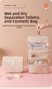 Detail of hanging travel toiletry bag showing waterproof compartments and hook for organization