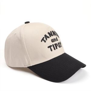 Two-tone baseball cap with TANNED and TIPSY letter embroidery and black curved brim