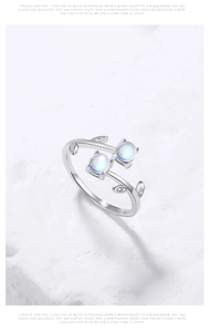 Detail of 925 silver vine ring featuring two blue moonstones and sparkling zircon leaves