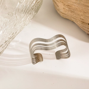 Minimalist silver wavy multi-layer open cuff bracelet with a polished stainless steel finish