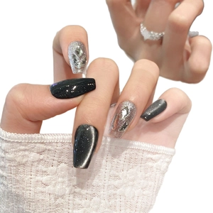 Black cat eye luxury press-on nails with silver glitter and rhinestone accents