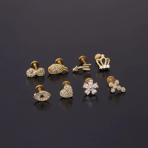 Set of 8 gold 16G stainless steel stud earrings with cubic zirconia and various charms