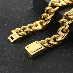 Close-up of golden Cuban and Mariner link bracelet with a polished box clasp for men