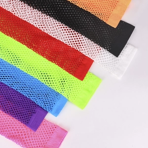 Detailed view of elastic fishnet arm warmers in multiple bright fluorescent colors