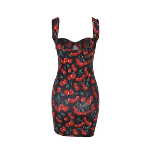 Close-up of black bodycon dress with vibrant cherry print and wide shoulder straps
