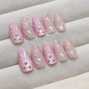 Press-on nail set with 3D shell relief and gold metallic lines in pearlescent pink