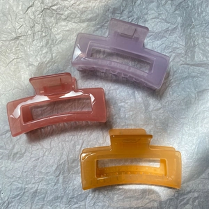 Minimalist jelly hair claw clips in purple, pink and orange acrylic for women
