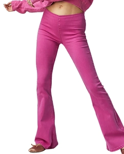 Close-up of pink flared denim jeans with a modern high-waisted fit and visible fabric texture