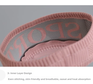 Detailed macro view of pink breathable sport headband with knitted jacquard lettering