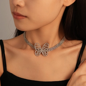 Detail of silver butterfly choker with four rows of sparkling rhinestones on neck