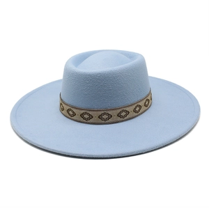 Close-up of light blue wool felt hat featuring ethnic geometric embroidery band detail