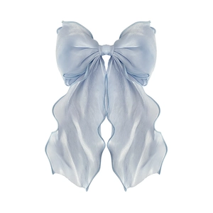 Elegant light blue satin ribbon bow hair clip with shimmering texture on white background