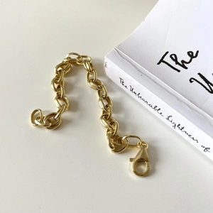 Detailed close-up of 925 silver gold chain bracelet with lobster clasp and hallmark