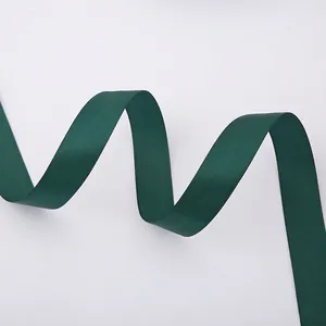 Detail of dark green polyester satin ribbon showing smooth texture and soft drape