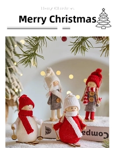 Detail of wooden Christmas dolls with knitted hats and scarves in a cozy festive setting