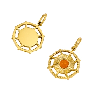 Macro detail of golden stainless steel pendant with orange gemstone and sunray texture