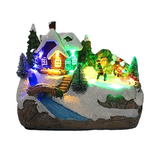 Maison de Noël LED miniature avec patineurs sur glace et lumières colorées décoratives