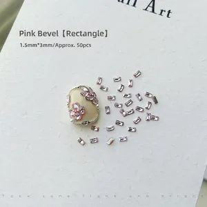 Close-up of 50pcs pink rectangular zircon nail gems with 1.5mm by 3mm dimensions