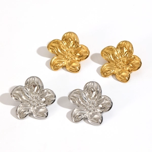 French vintage 18k gold and silver flower stud earrings in stainless steel on white back