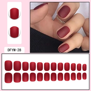 Detailed set of matte wine red press-on nails with full size range and professional finish