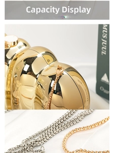 Detail showing the polished golden metal surface and dual metallic chain options