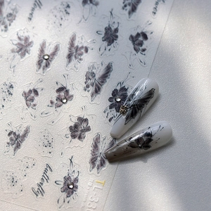 Vintage butterfly and floral embossed nail stickers with sparkling rhinestones and ink art