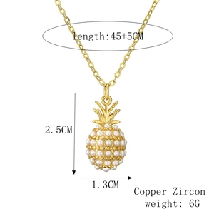 Detail of gold pineapple pendant with pearls, showing dimensions and copper zircon material