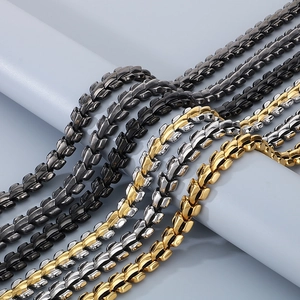 Macro view of dragon bone link bracelets in polished black, gold and silver finishes