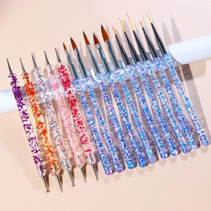 Detailed set of 15 nail art brushes with glitter acrylic handles on a white mat