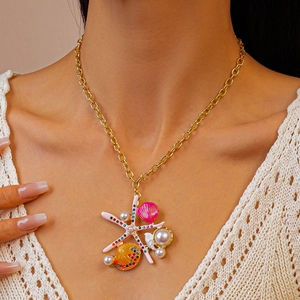 Starfish and shell necklace with pearls and rhinestones on a gold chain for beach vacation