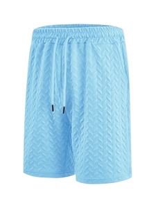 Detail showing light blue herringbone knit texture and drawstring waistband of men's shorts