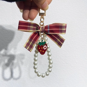 Cute strawberry keychain with red plaid bow and pearl chain details for bags