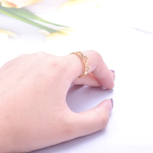 Adjustable golden stainless steel open ring with continuous hollow heart design