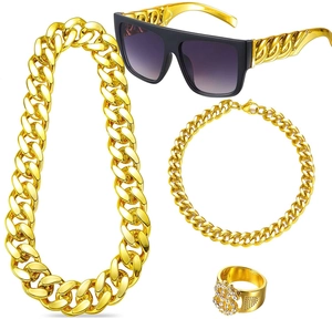 Detailed set of chunky gold hip hop jewelry including chain, bracelet, ring, and sunglasses