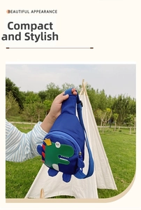 Detailed view of the cute blue nylon dinosaur chest bag with a green cartoon patch