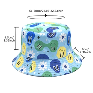 Light blue reversible bucket hat with graffiti smiley faces and daisy prints for sun protection