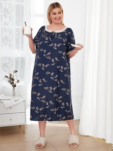 Detail of plus size paisley print sleepwear with elegant white lace trim and bow knot