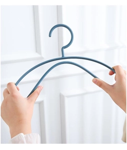 Detail of high flexibility non-slip hanger being bent to show durable curved wide shoulder