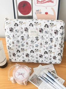 Quilted white cosmetic bag with cute cartoon dog prints and bubble texture for travel