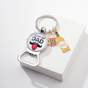 Detail of metal bottle opener keychain with I LOVE MY DAD engraving and beer charms
