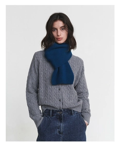 Close-up of a soft navy blue 100% Australian wool scarf with classic knit texture